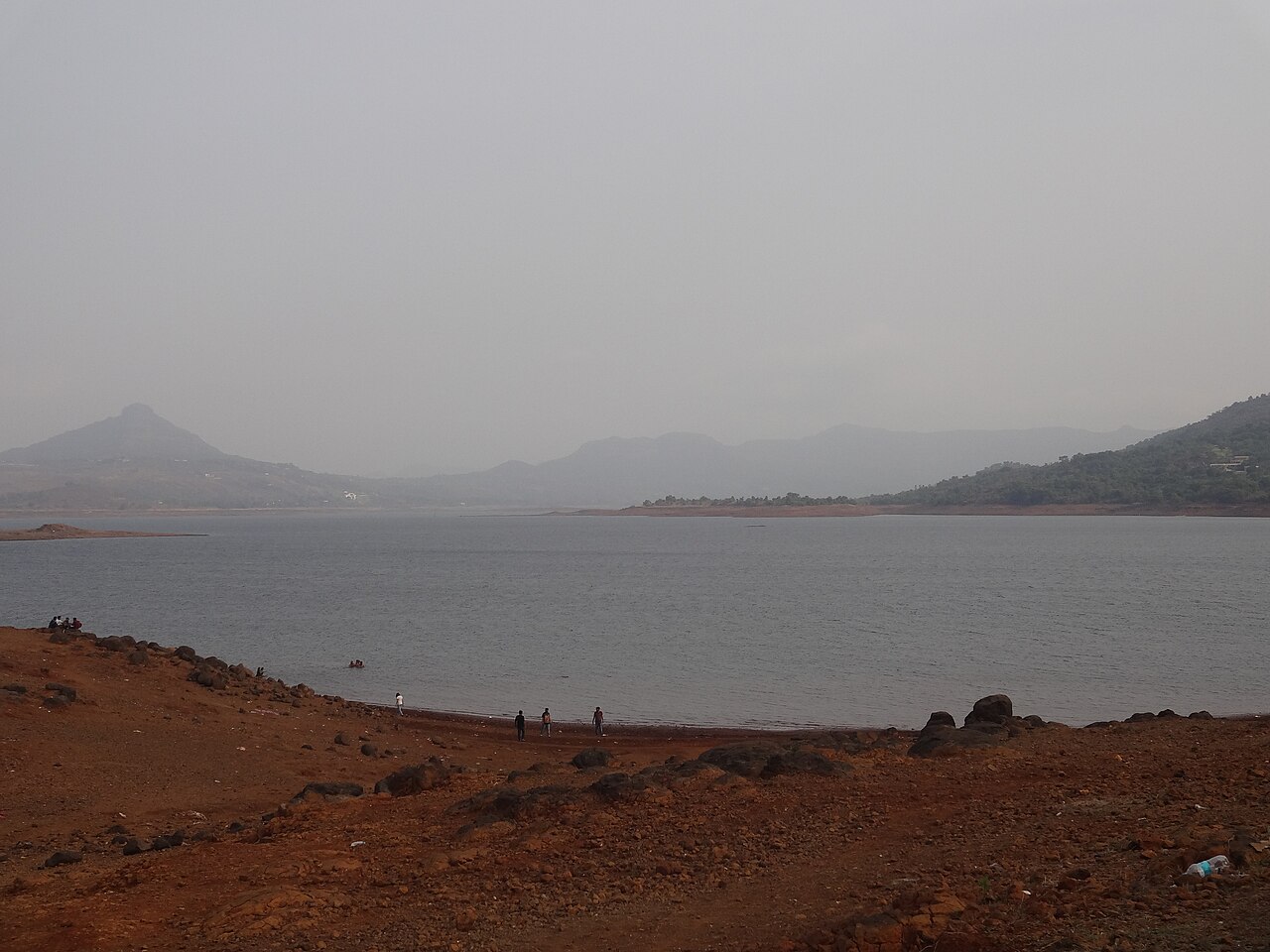 Calm waters of Pawna Lake ringed by hills near Lonavala