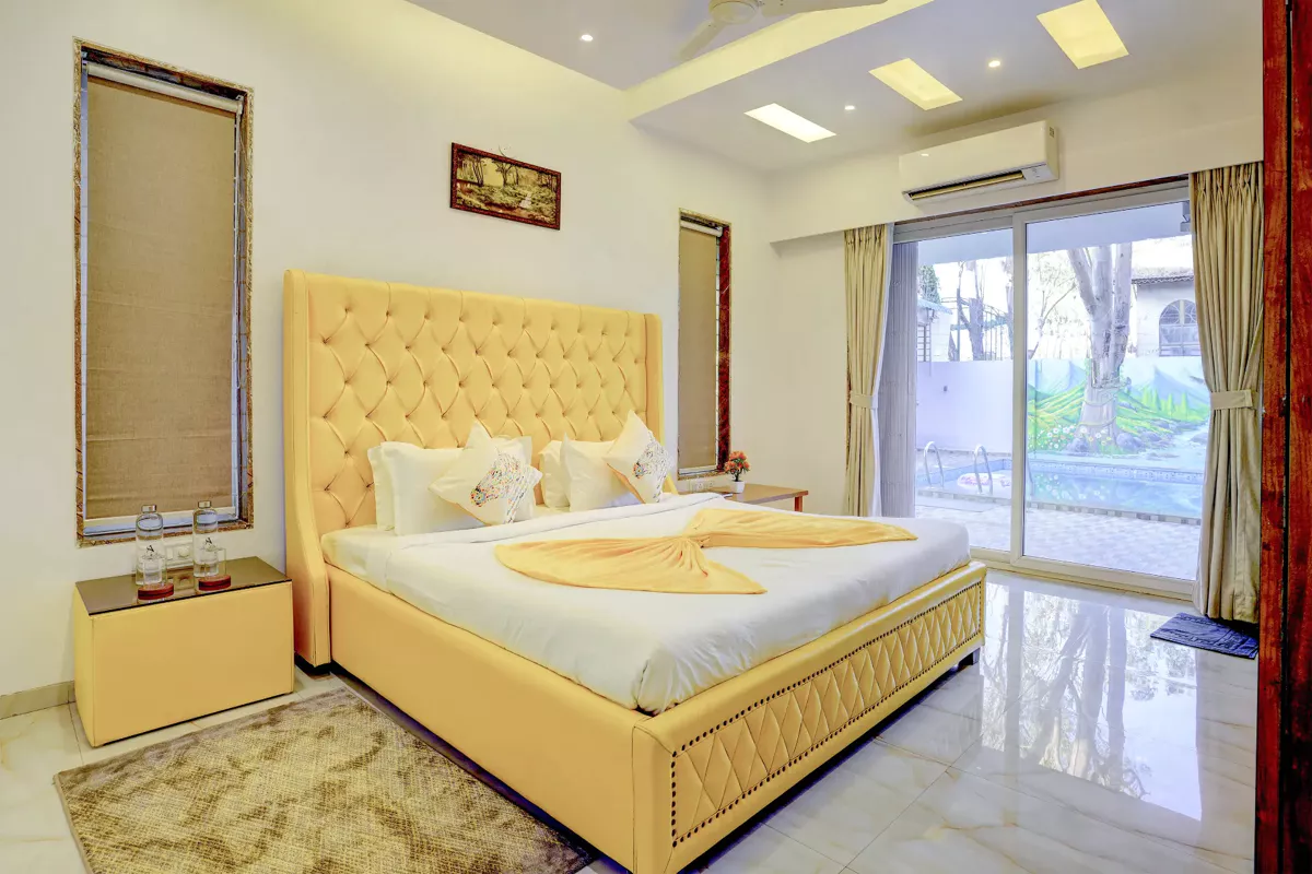 Second bedroom on ground floor with king bed at LonavillaStay