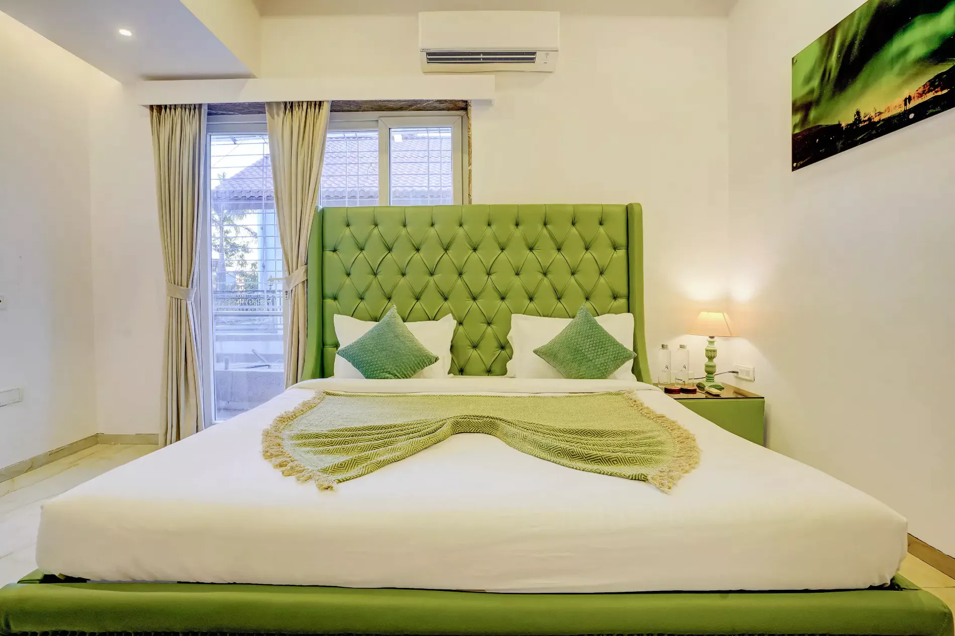 Third bedroom on first floor with king bed and pool view at LonavillaStay