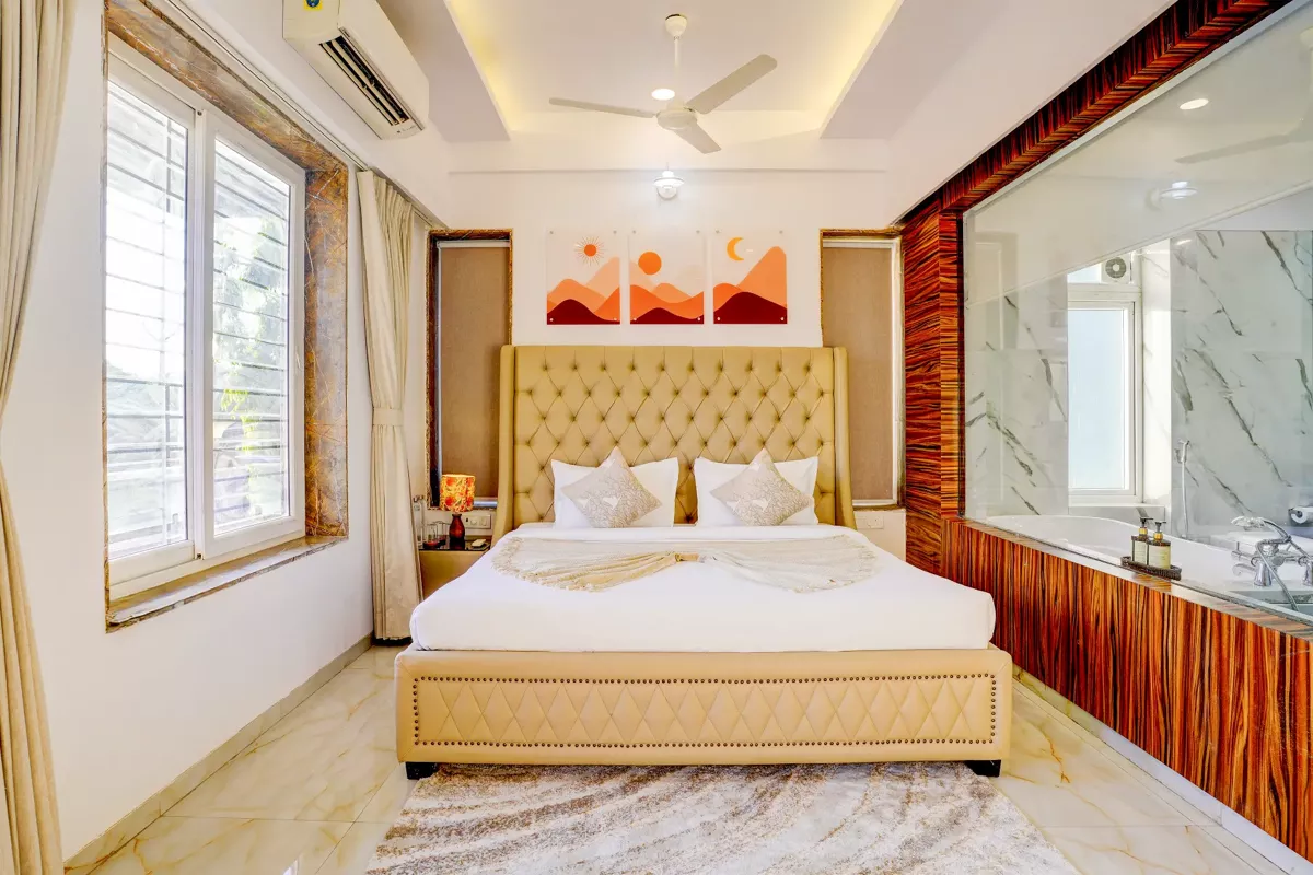 Master suite with king bed at LonavillaStay 4BHK villa