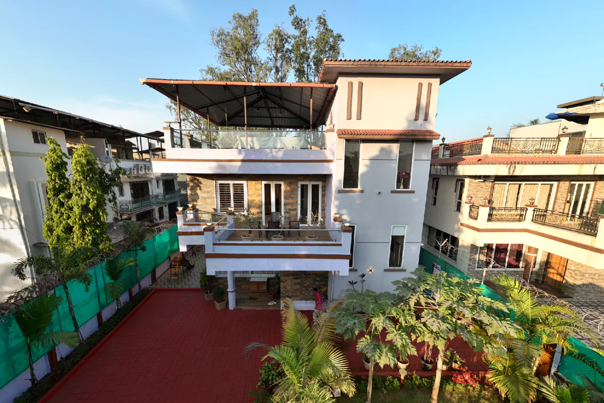 Villa exterior with garden at LonavillaStay in Lonavala
